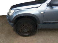 Suzuki Grand Vitara 2005–2017 Lokasuojan kaarilevikkeet (4 kpl, mustat) kuva 1