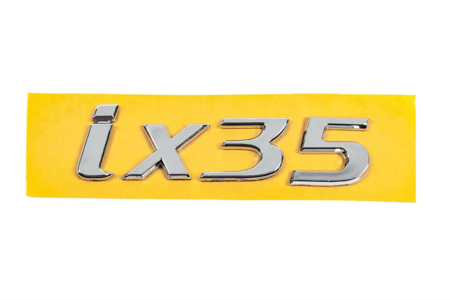 Hyundai IX-35 2010–2015 IX35-teksti (mallimerkki) 86310-2S010 (135 x 37 mm) Image
