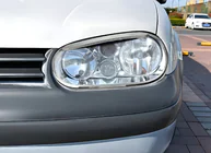 Volkswagen Golf 4 1997–2006 Ajovalojen kehyslistat V3 (2 kpl, muovi) kuva 1
