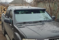 Nissan Navara 2006–2015 Tuulilasin aurinkolippa (rungolla) kuva 1