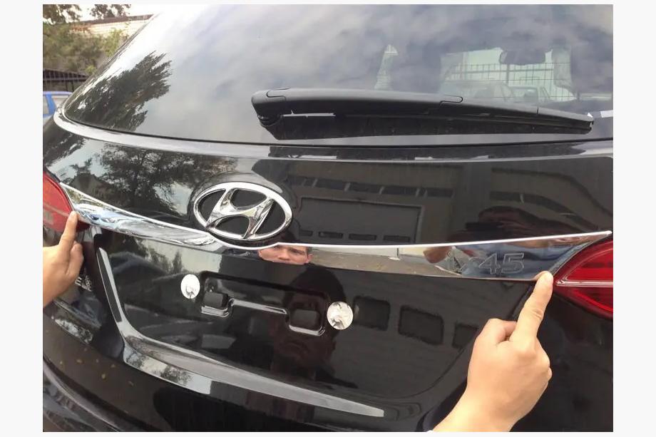 Hyundai Santa Fe 3 2012–2018 Kromilista rekisterikilven yläpuolelle Image